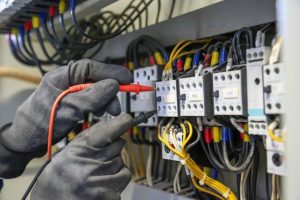 Premium Photo _ Electrical engineer using digital meter to checking electric current voltage at circuit breaker_